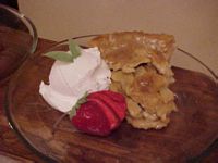 Slice of apple pie with a scoop of ice cream