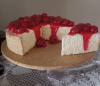 Cheesecake w Cherries Puffed Middle with 2 Slice Out 